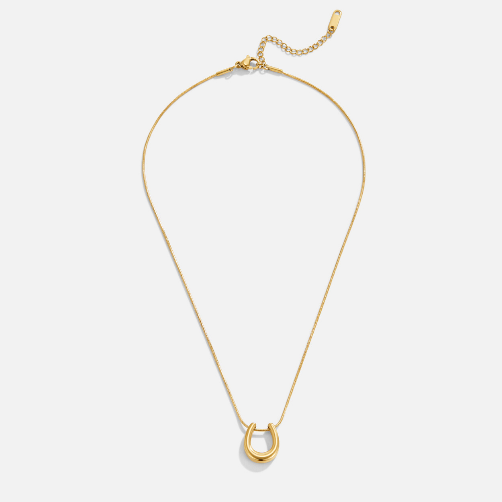Collar dorado con herradura