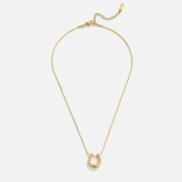 Collar dorado con herradura