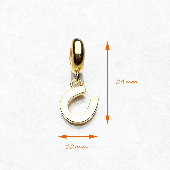 Colgante de oro en forma de herradura