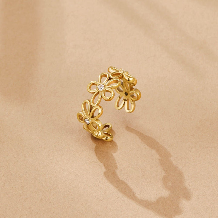 Anillo dorado infinito sauvages flores