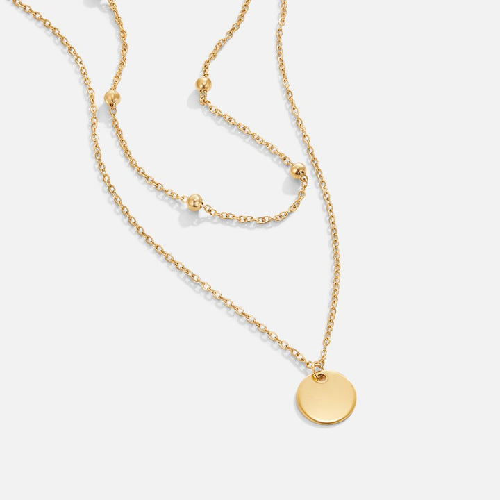 Collar multicapa con medallones