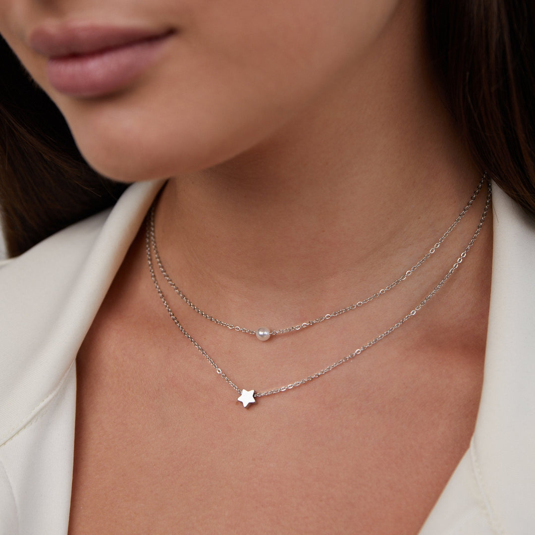 Collar de plata multicapa con estrella y perla
