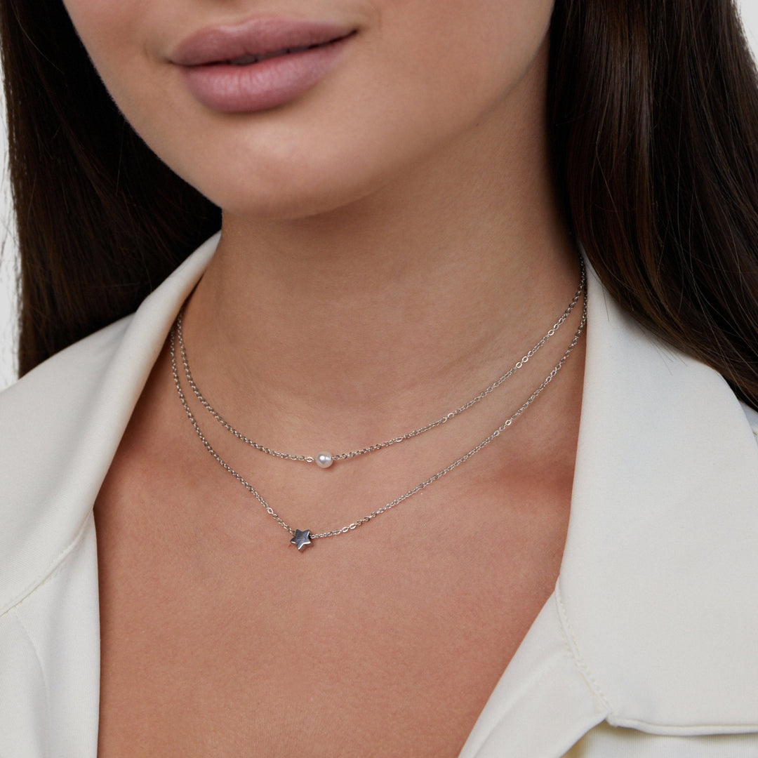 Collar de plata multicapa con estrella y perla