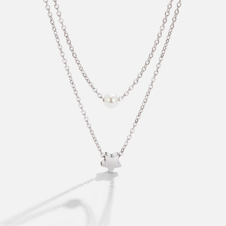 Collar de plata multicapa con estrella y perla